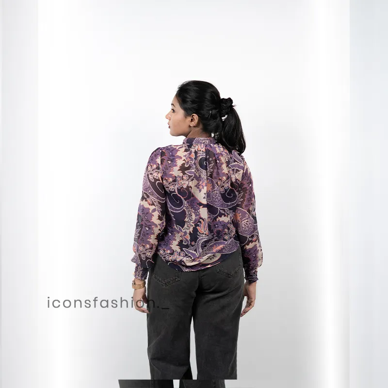 Women-wearing-a-purple-floral-print-high-neck-top-with-full-sleeves-mock-detailing-and-a-relaxed-fit-design