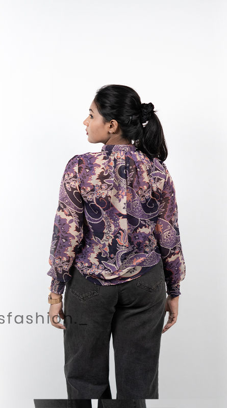 Women-wearing-a-purple-floral-print-high-neck-top-with-full-sleeves-mock-detailing-and-a-relaxed-fit-design