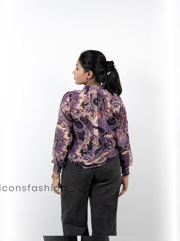 Women-wearing-a-purple-floral-print-high-neck-top-with-full-sleeves-mock-detailing-and-a-relaxed-fit-design