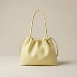 Pastel-yellow-faux-leather-ruched-shoulder-bag-with-drawstring-detail-spacious-lined-interior-and-inner-zip-pocket