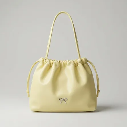 Pastel-yellow-faux-leather-ruched-shoulder-bag-with-drawstring-detail-spacious-lined-interior-and-inner-zip-pocket