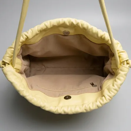 Pastel-yellow-faux-leather-ruched-shoulder-bag-with-drawstring-detail-spacious-lined-interior-and-inner-zip-pocket
