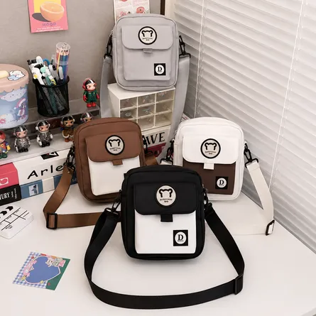 Mini-crossbody-bag-with-front-flap-pocket-adjustable-shoulder-strap-bear-logo-patch-and-zippered-compartment
