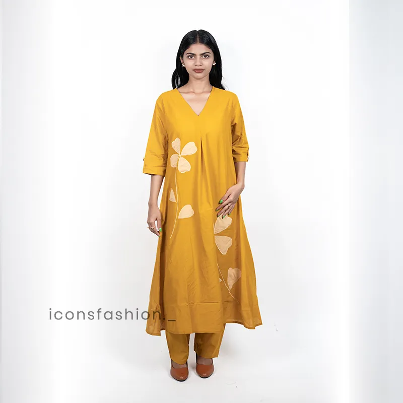 Women-a-yellow-A-line-kurta-set-with-floral-applique-work-three-quarter-sleeves-and-matching-pants