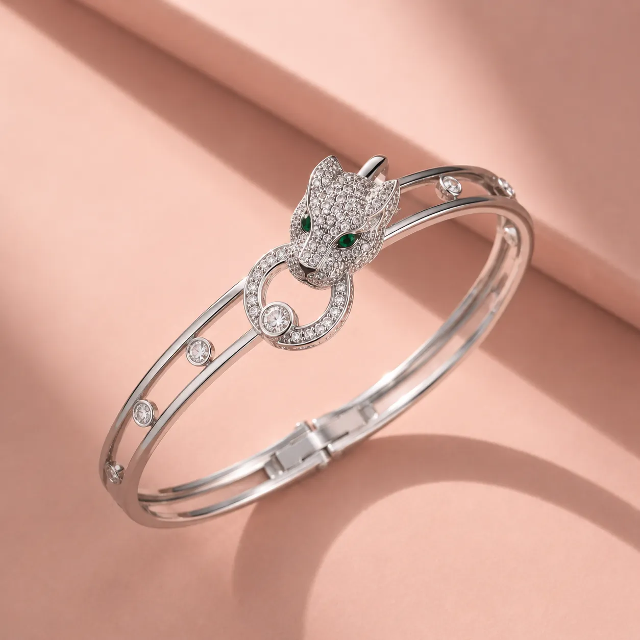 Silver-tone-panther-head-bracelet-with-crystal-embellishments-green-stone-eyes-and-sleek-hinged-bangle-design