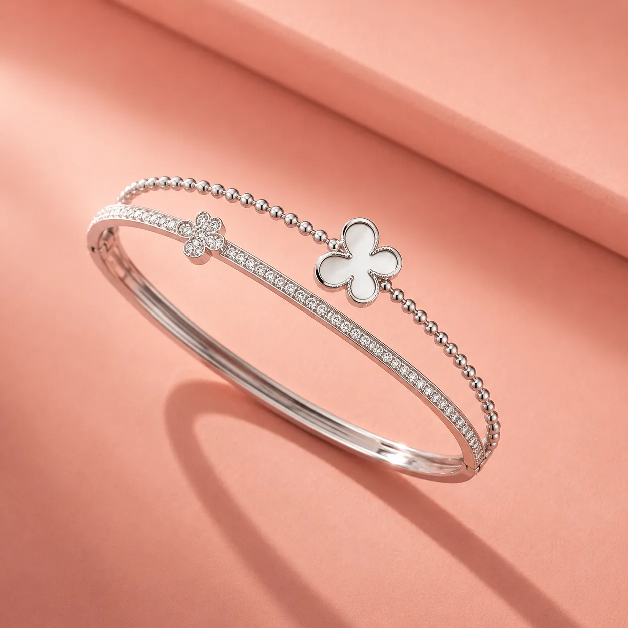 Silver-crystal-floral-charm-bracelet-with-clover-detail-and-polished-finish-for-women