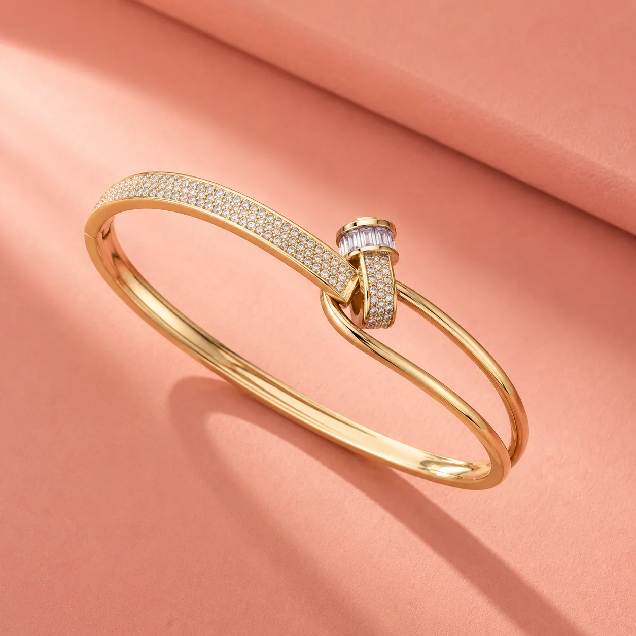 Gold-crystal-studded-nail-bracelet-with-polished-finish-and-modern-wrap-design-for-women
