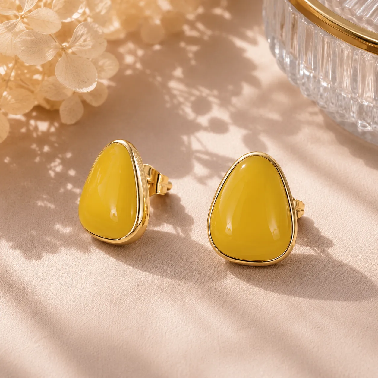 Yellow-teardrop-stud-earrings-with-gold-tone-border-and-glossy-finish-for-women