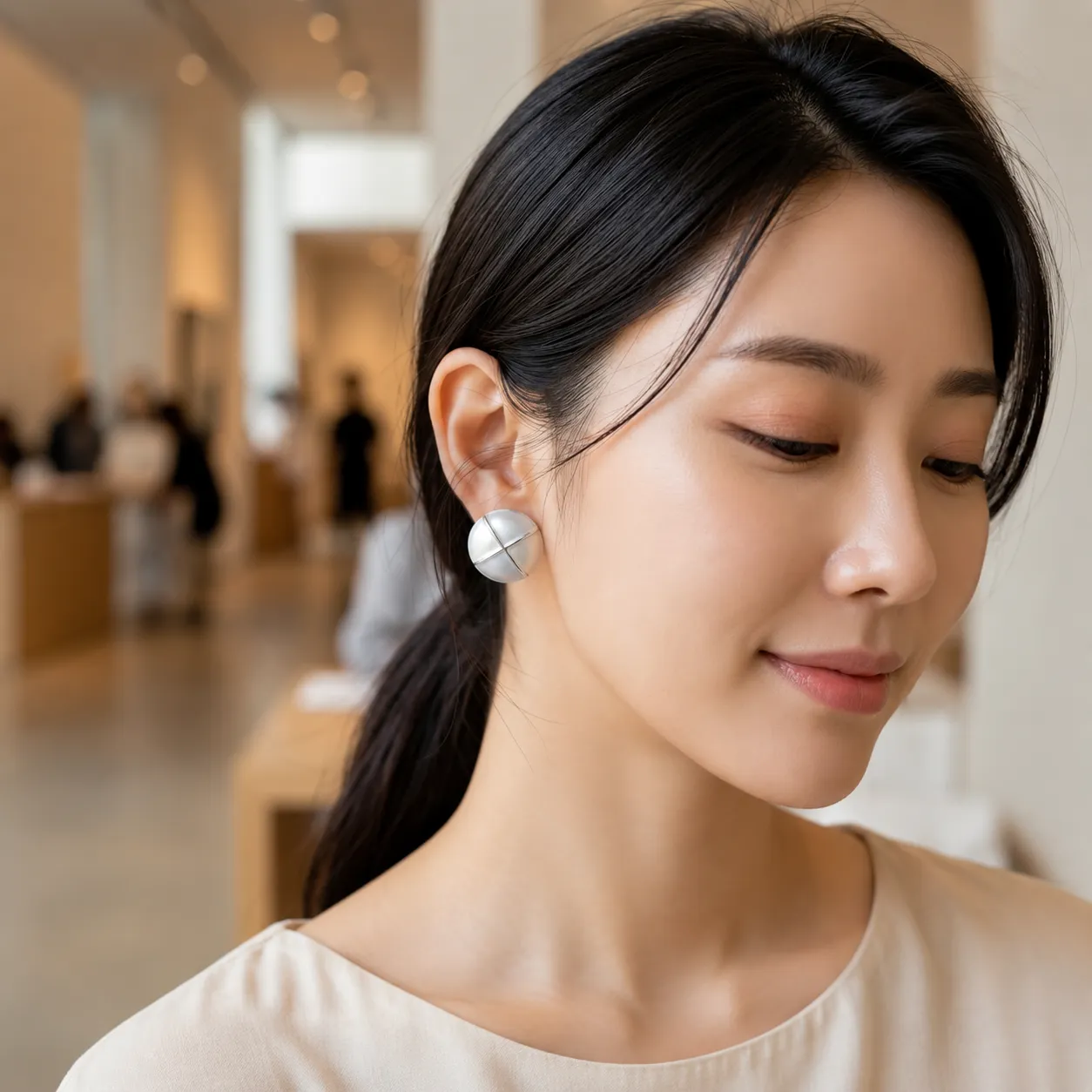 White-round-pearl-stud-earrings-with-silver-tone-geometric-design-for-women