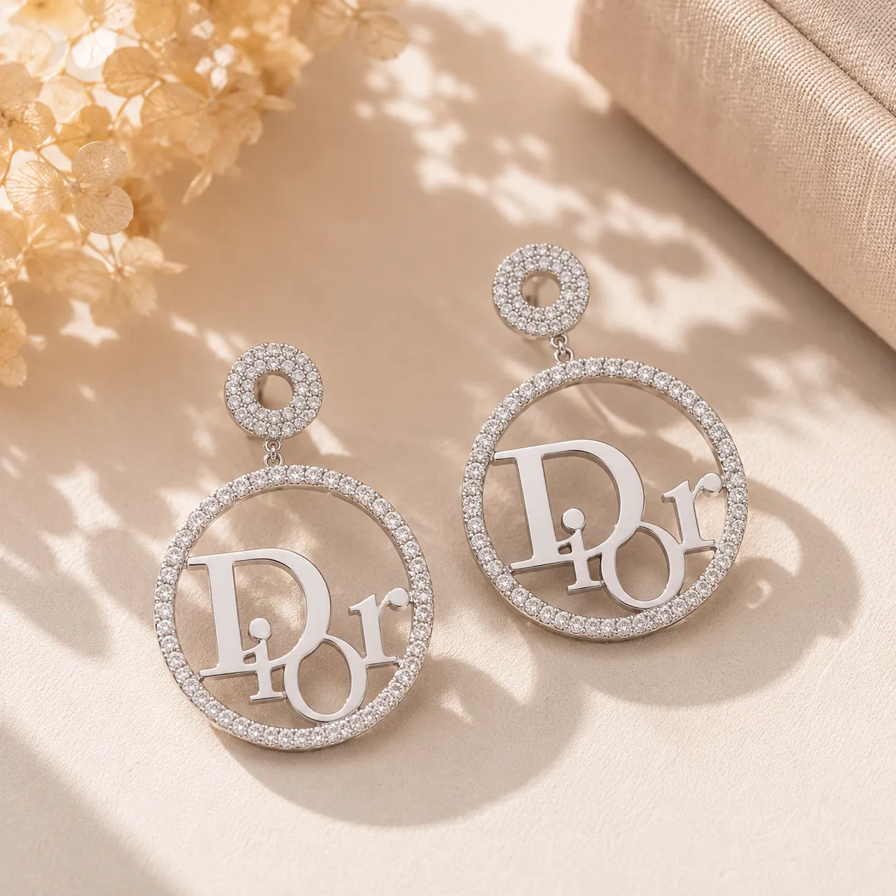 Silver-crystal-studded-circular-drop-earrings-with-designer-inspired-letter-detail-for-women