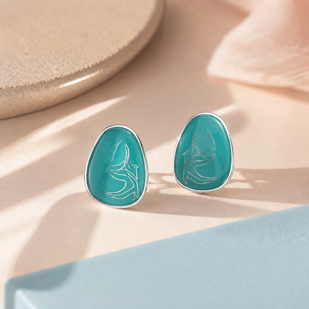 Blue-teardrop-stud-earrings-with-gold-tone-border-and-glossy-finish-for-women