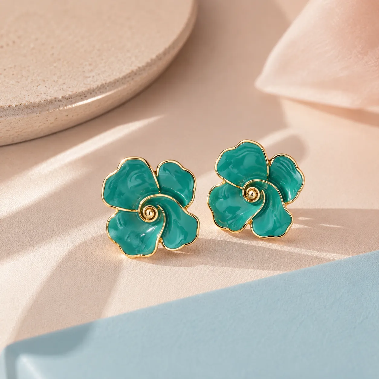 Bluee-floral-stud-earrings-with-gold-tone-outline-and-glossy-enamel-finish-for-women