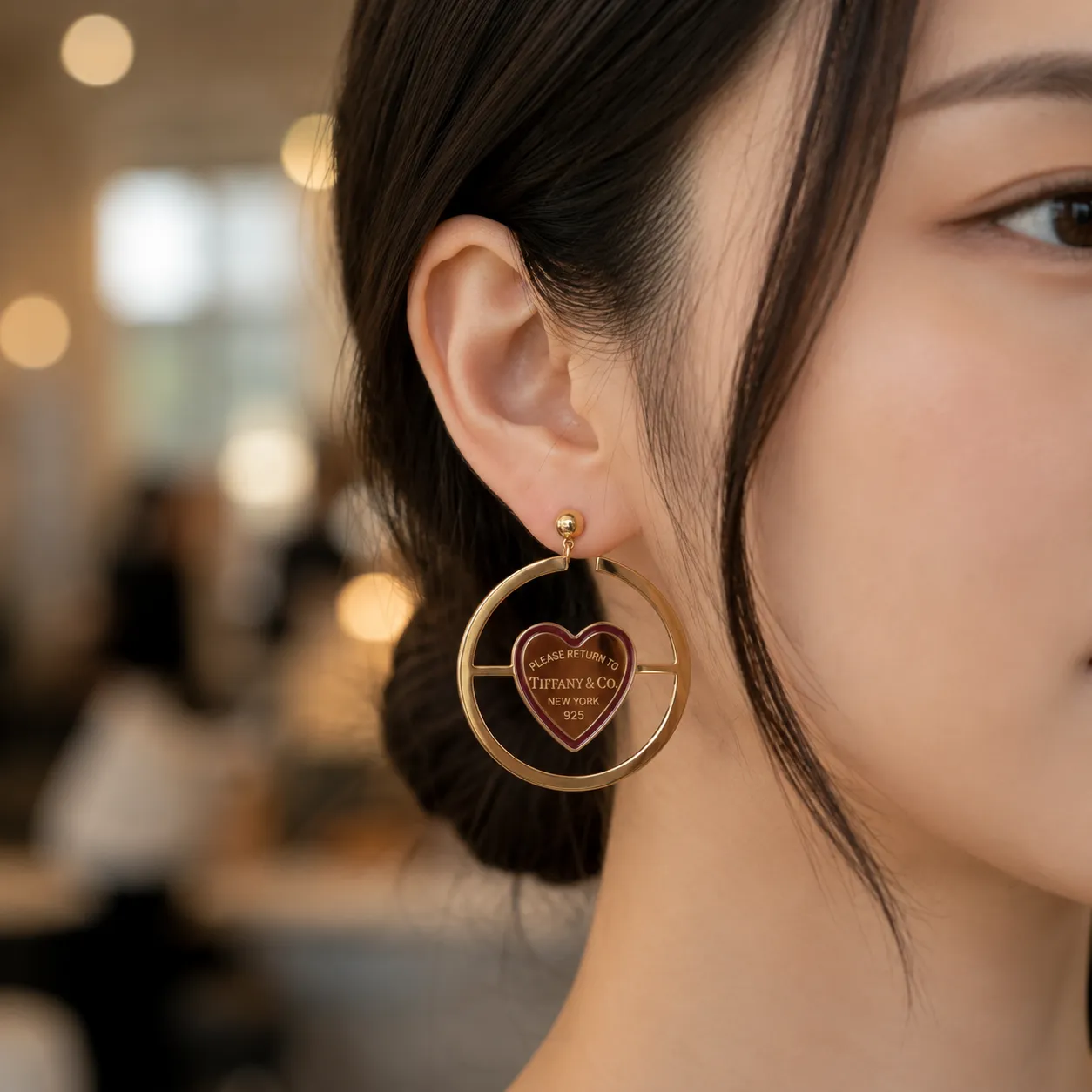Gold-heart-charm-hoop-earrings-with-circular-frame-design-for-women
