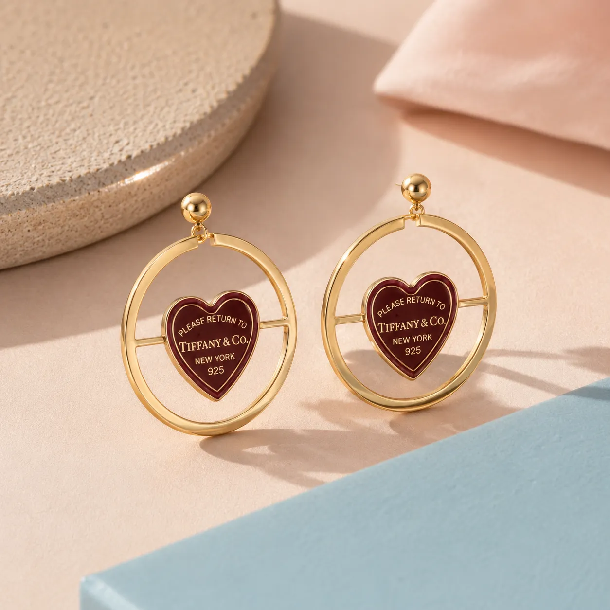 Gold-heart-charm-hoop-earrings-with-circular-frame-design-for-women