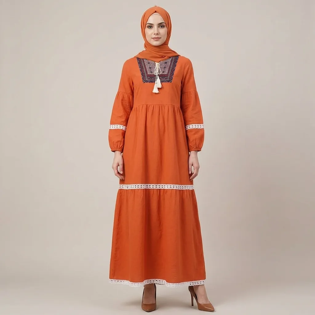 Orange-embroidered-tiered-maxi-dress-with-tassel-tie-neck-and-long-puff-sleeves