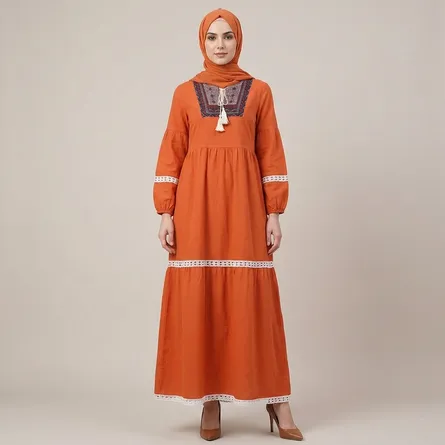 Orange-embroidered-tiered-maxi-dress-with-tassel-tie-neck-and-long-puff-sleeves