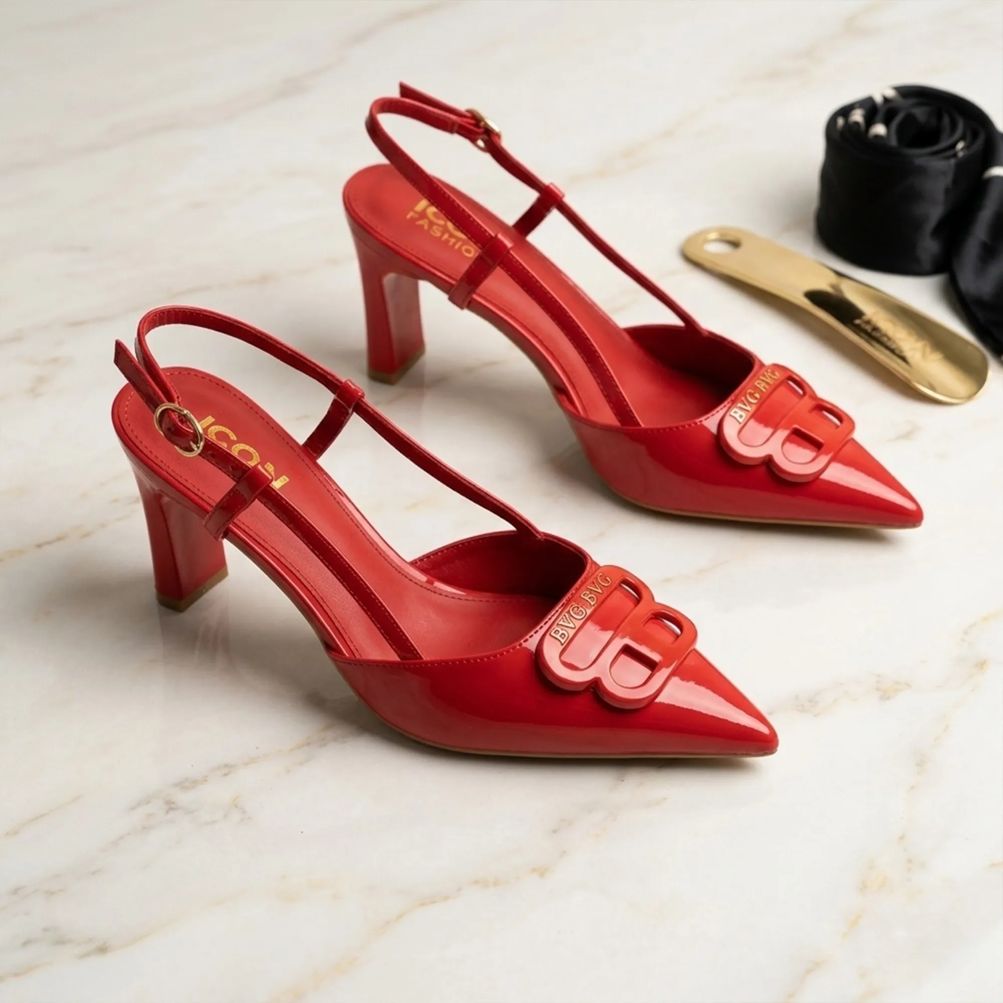 Red-pointed-toe-slingback-high-heel-pumps-for-women-with-glossy-patent-finish-and-front-embellishment-detail