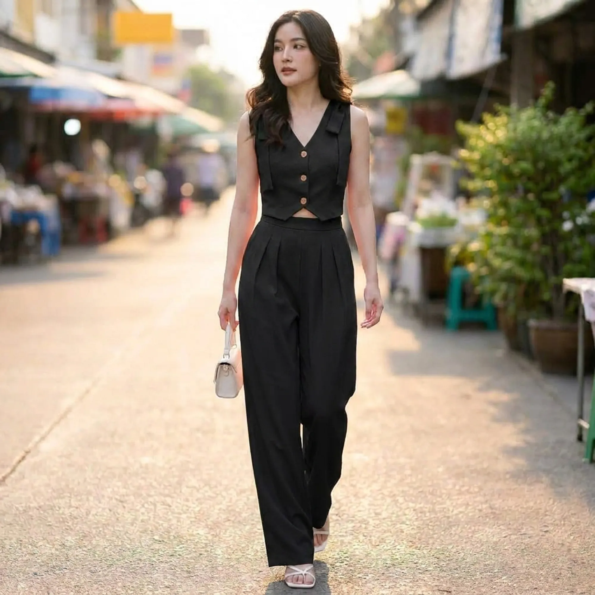 Black-sleeveless-co-ord-set-for-women-with-v-neck-button-front-crop-vest-and-high-waist-wide-leg-trousser
