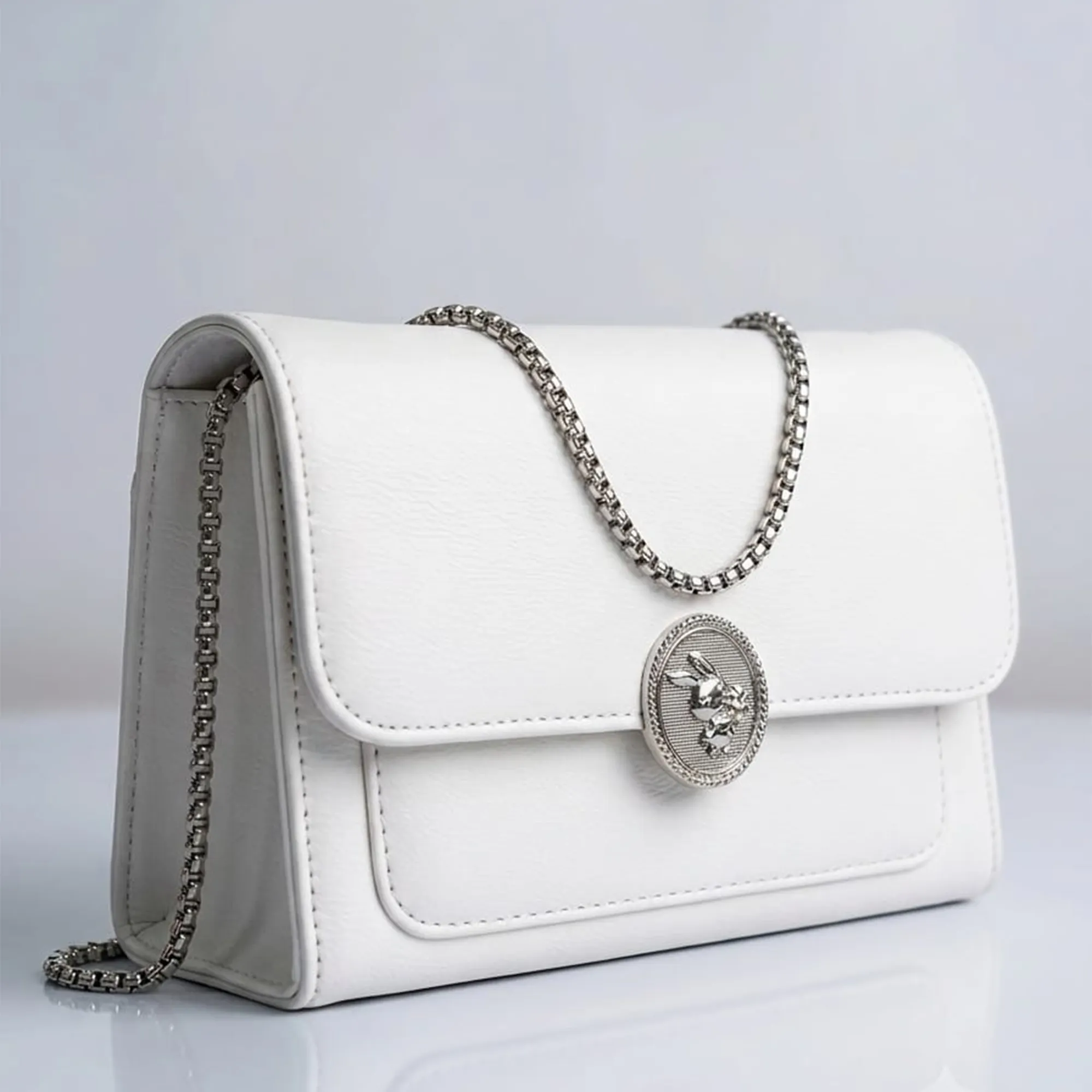 White-leather-chain-sling-bag-with-metal-clasp-for-women