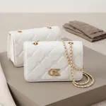 White-quilted-chain-sling-bag-with-gold-metal-detail-for-women