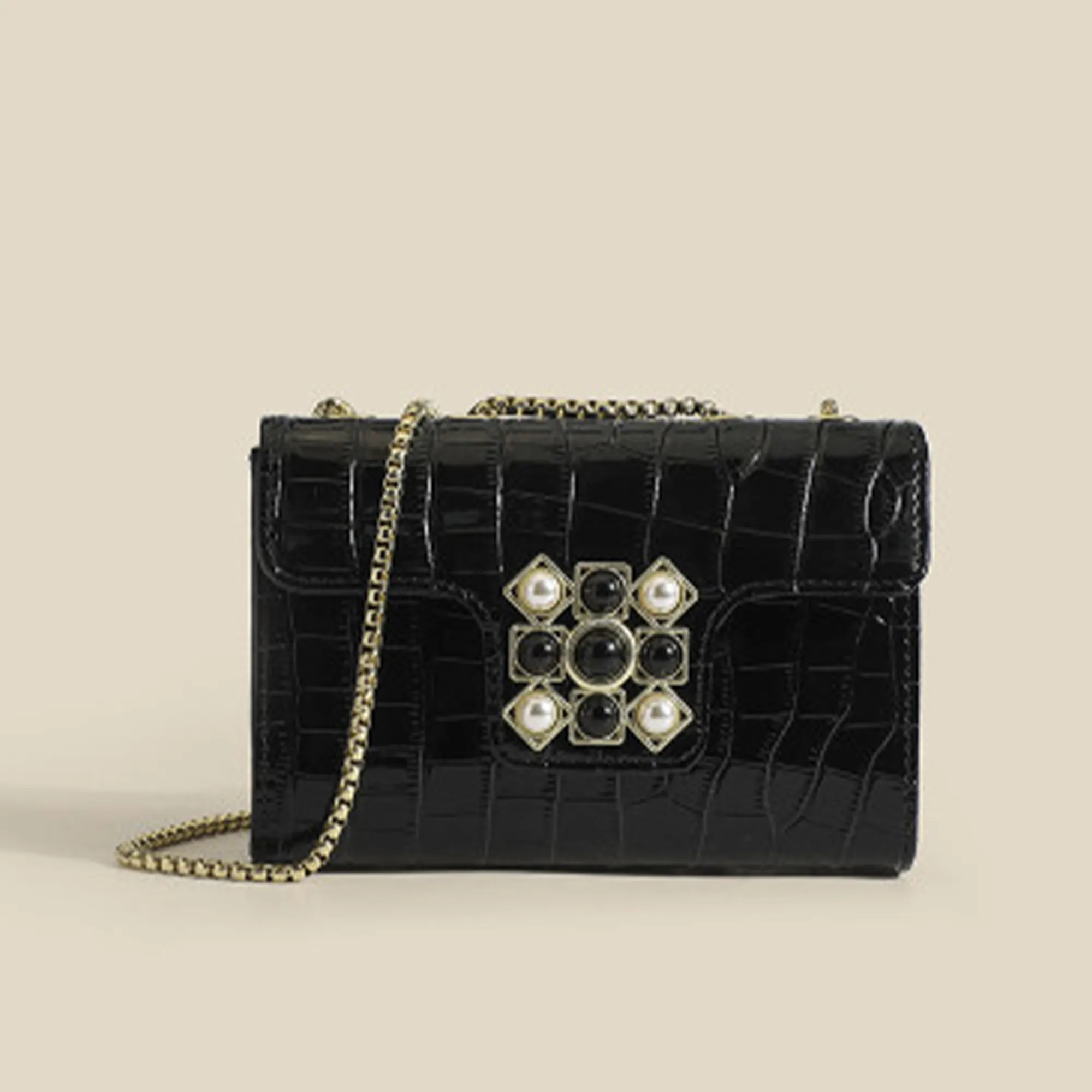 Black-croc-embossed-chain-sling-bag-with-embellished-clasp-for-women