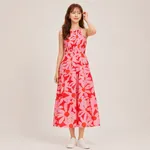 Pink-floral-halter-neck-tiered-maxi-dress-for-women-with-cross-back-straps-and-oversized-floral-print