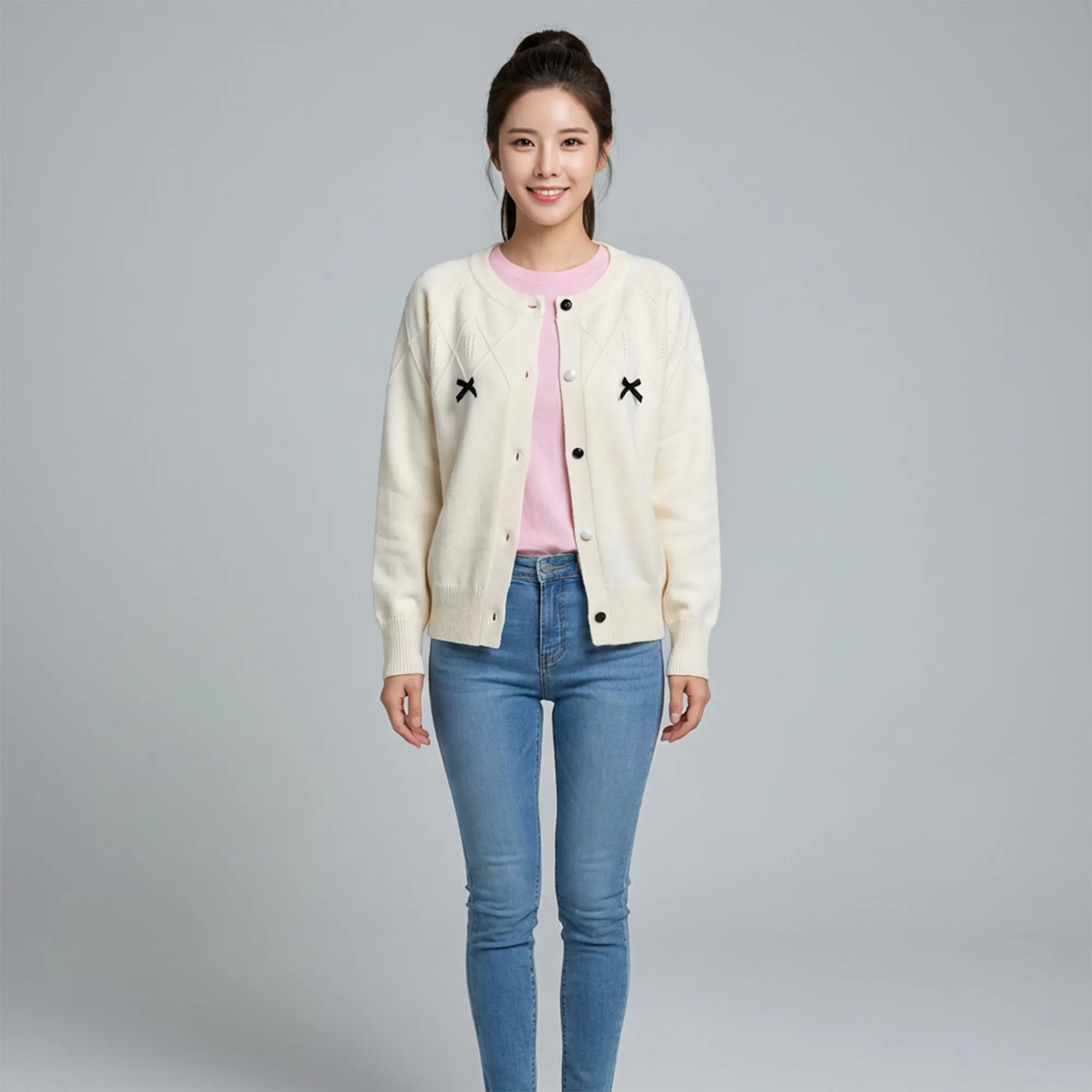 Cream-knit-button-front-cardigan-sweater-for-women-with-black-bow-details-and-full-sleeves