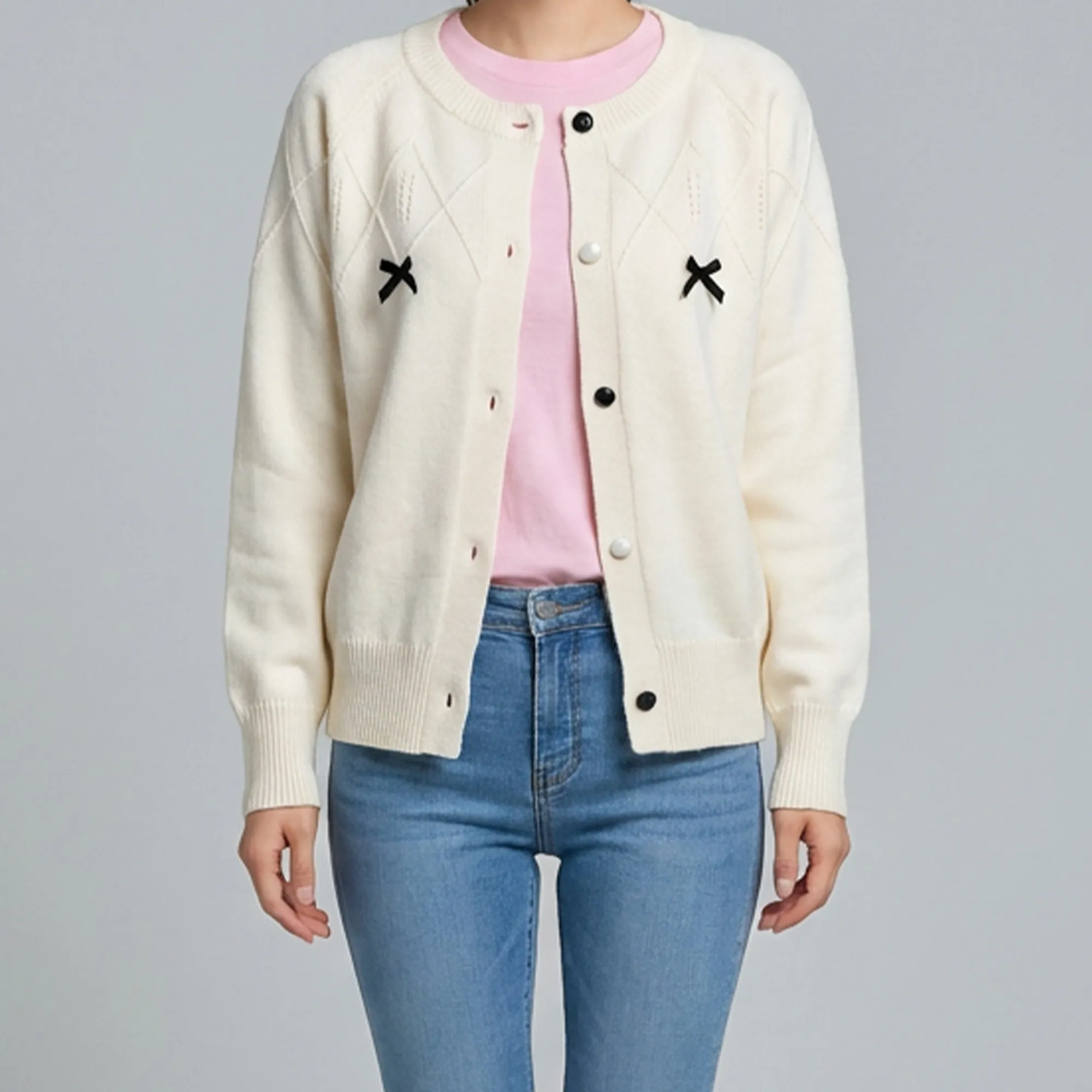 cream-knit-button-front-cardigan-sweater-for-women-with-black-bow-details-and-full-sleeves
