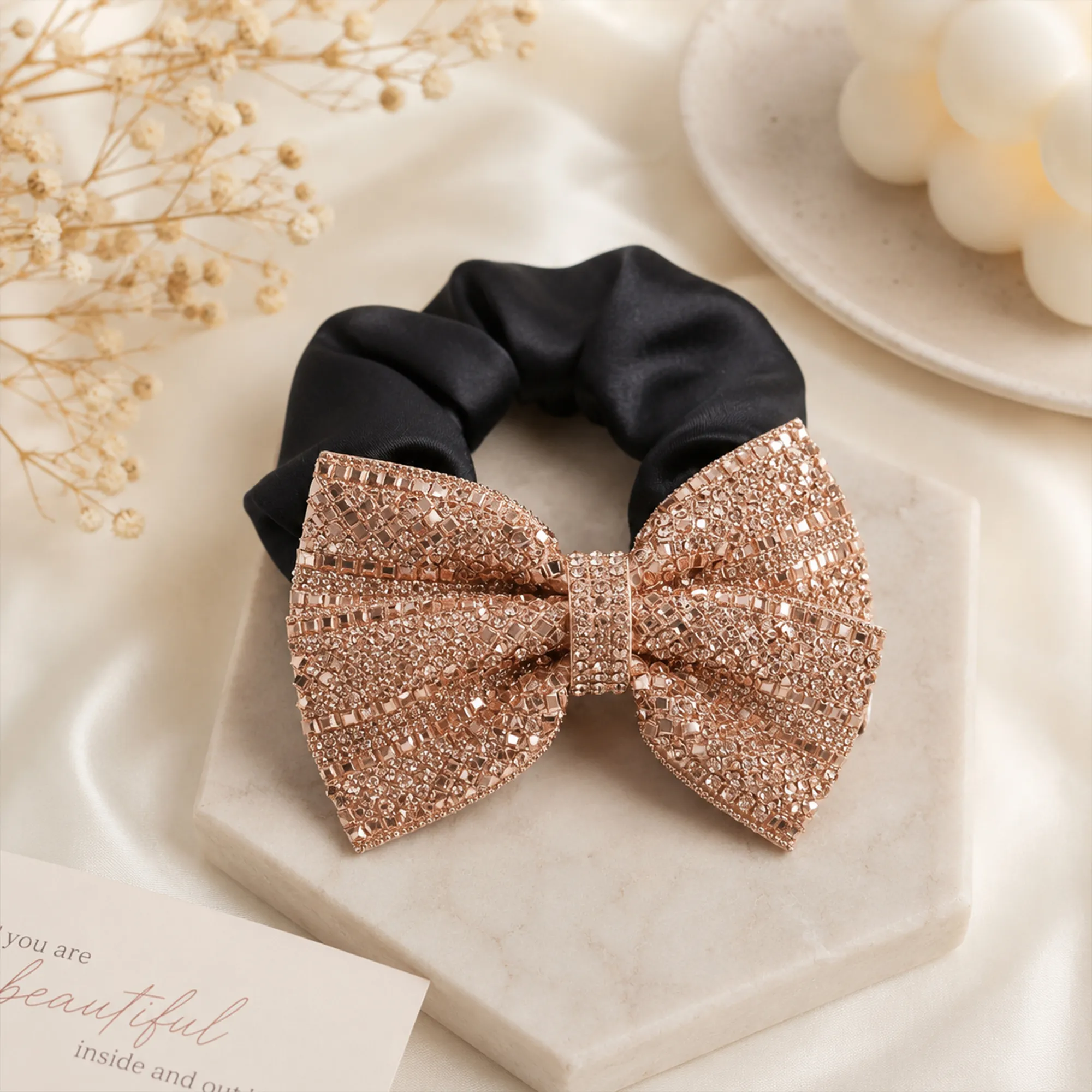 Black-satin-scrunchie-with-rose-gold-embellished-bow-hair-accessory