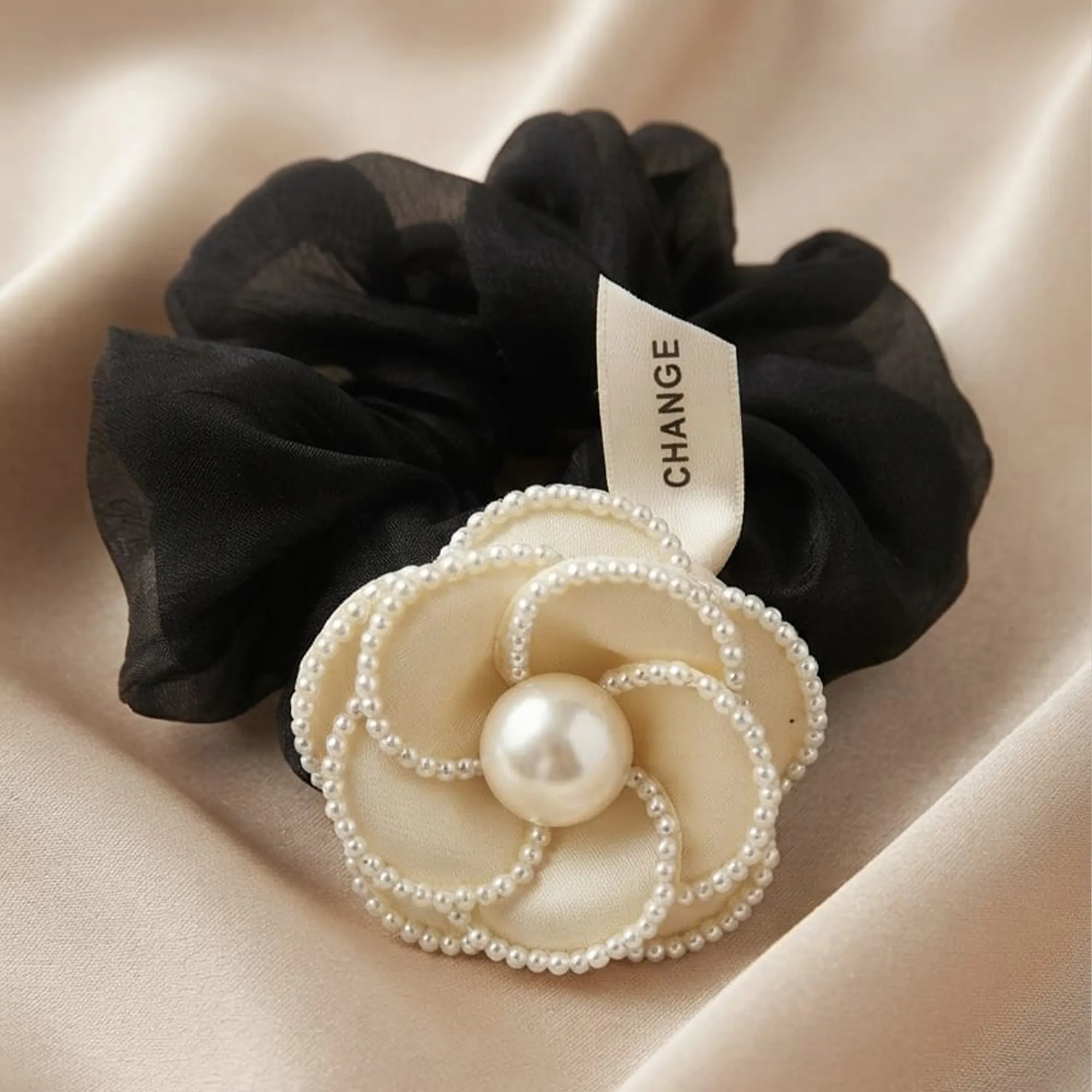 Black-scrunchie-with-cream-pearl-flower-embellishment-hair-accessory