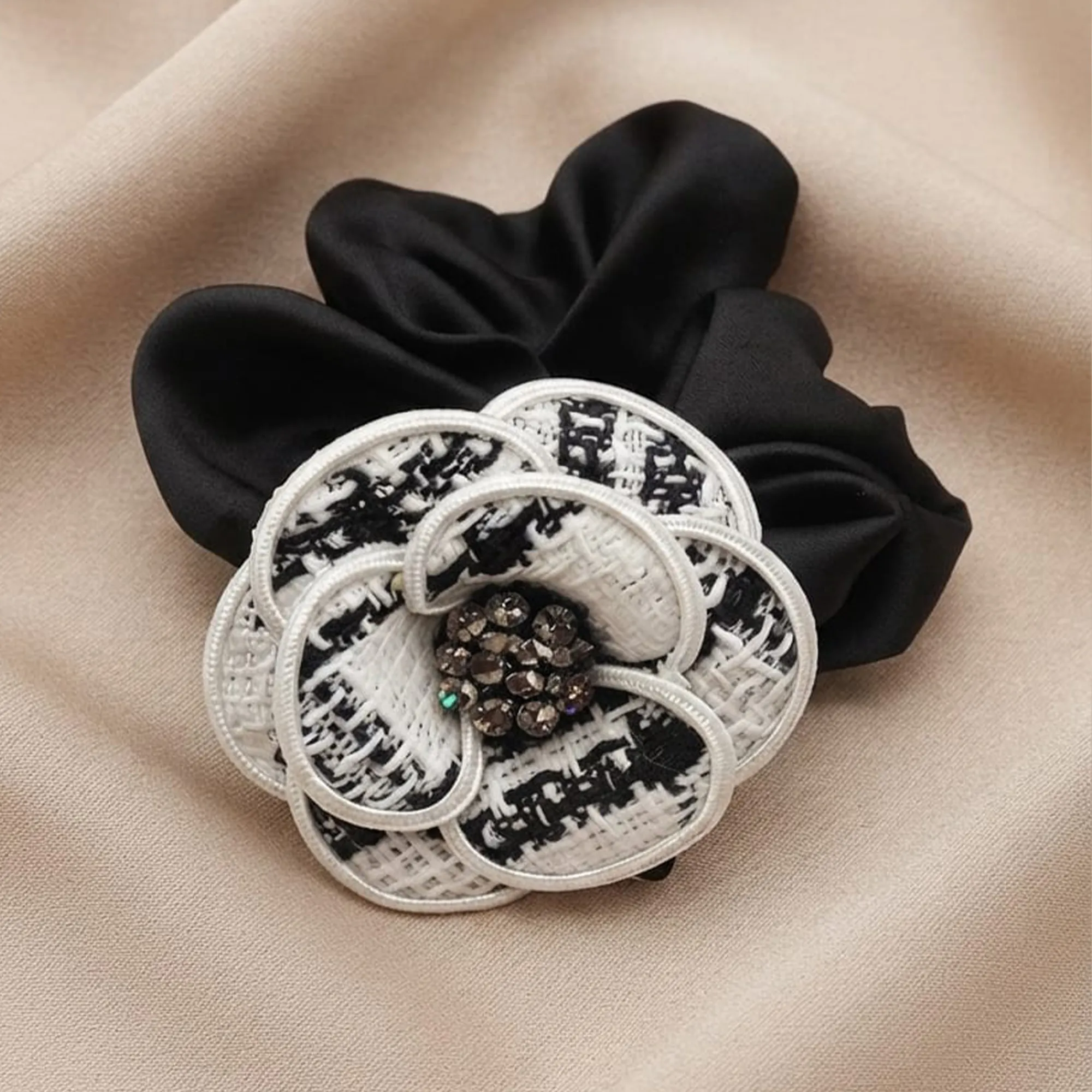 Black-scrunchie-with-black-and-white-floral-embellishment-and-beaded-center