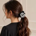 Black-scrunchie-with-black-and-white-floral-embellishment-and-beaded-center