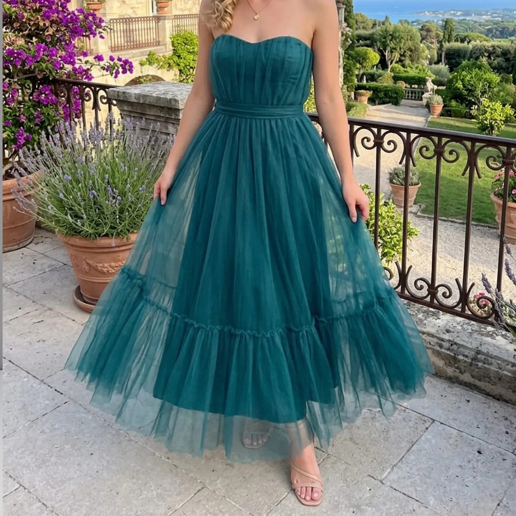 Teal-strapless-tulle-maxi-dress-with-pleated-bodice-and-tiered-skirt-for-women-front-view