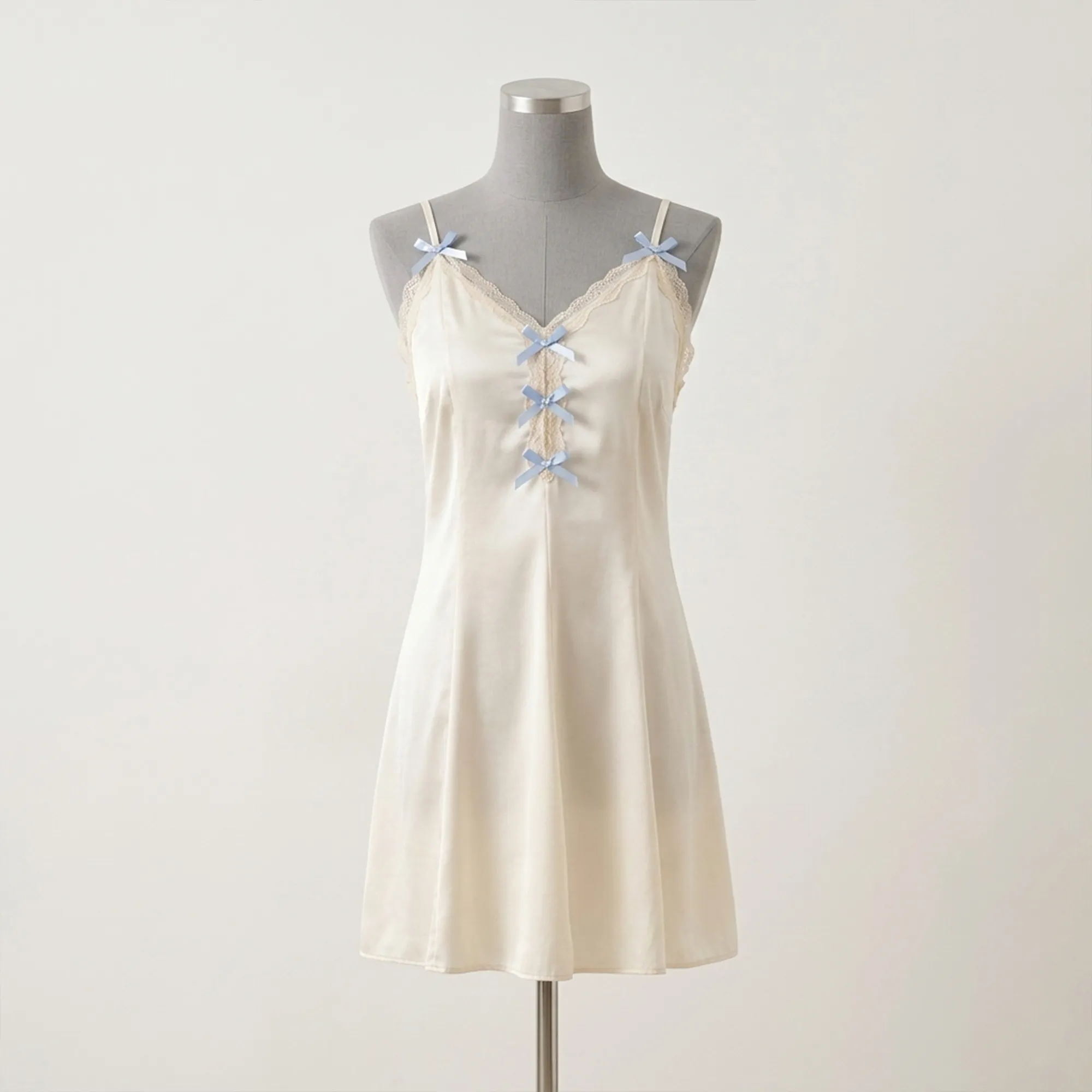 Ivory-satin-slip-nightdress-with-lace-trim-and-blue-bow-details