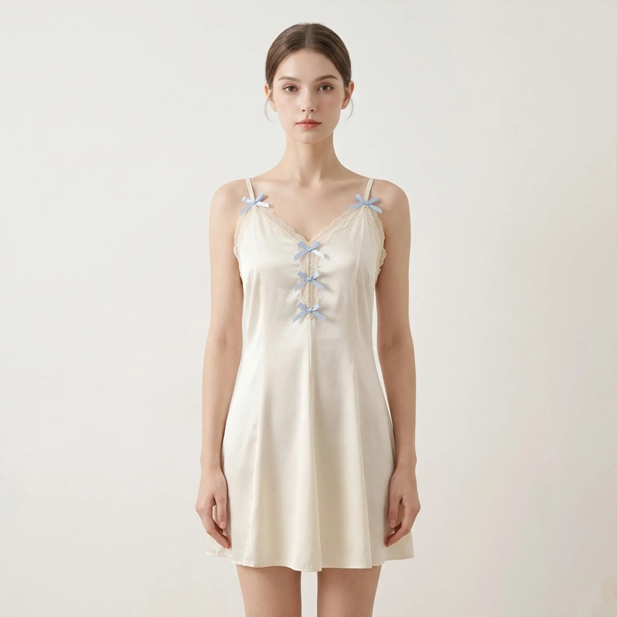 Ivory-satin-slip-nightdress-with-lace-trim-and-blue-bow-details