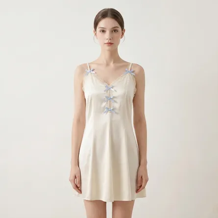 Ivory-satin-slip-nightdress-with-lace-trim-and-blue-bow-details