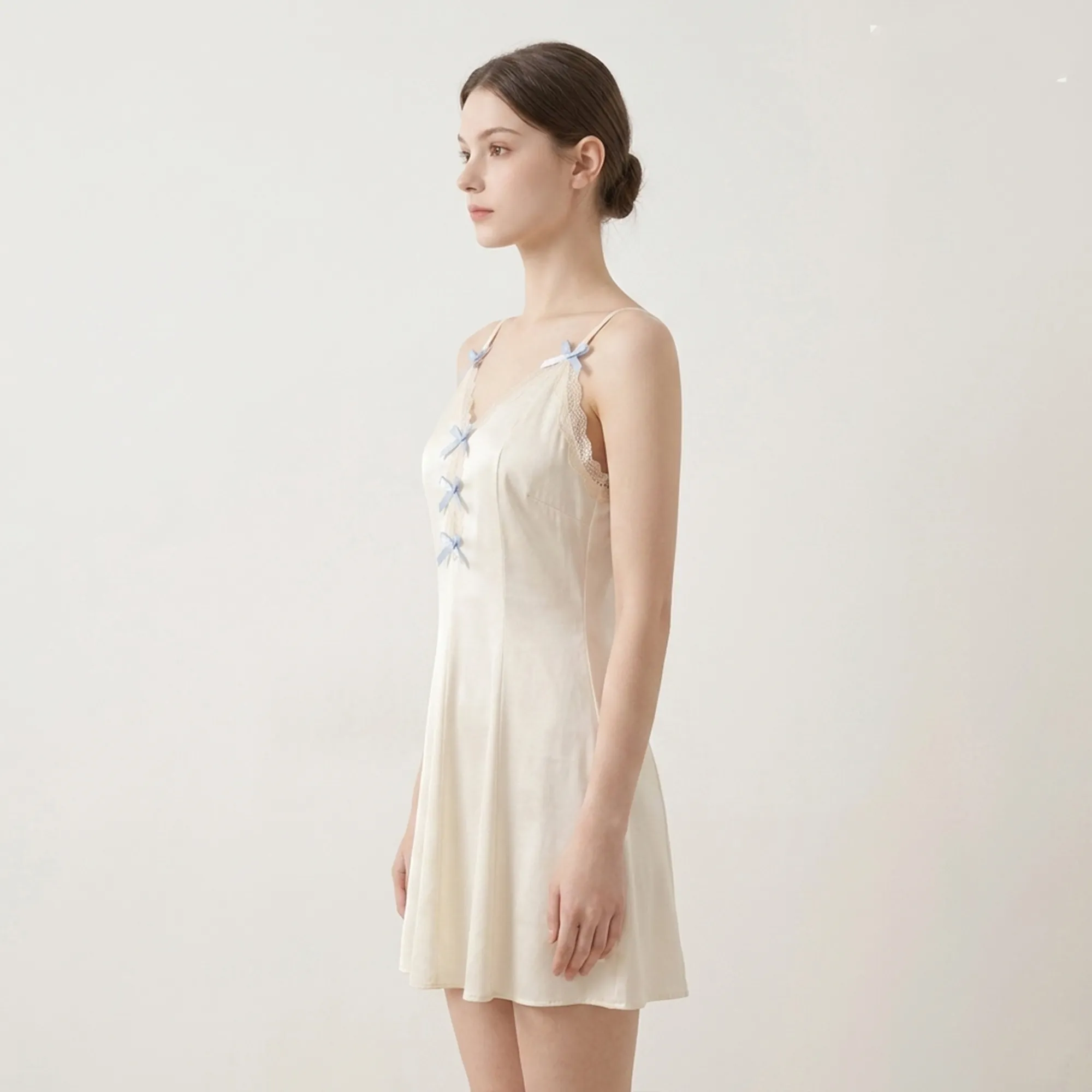 Ivory-satin-slip-nightdress-with-lace-trim-and-blue-bow-details