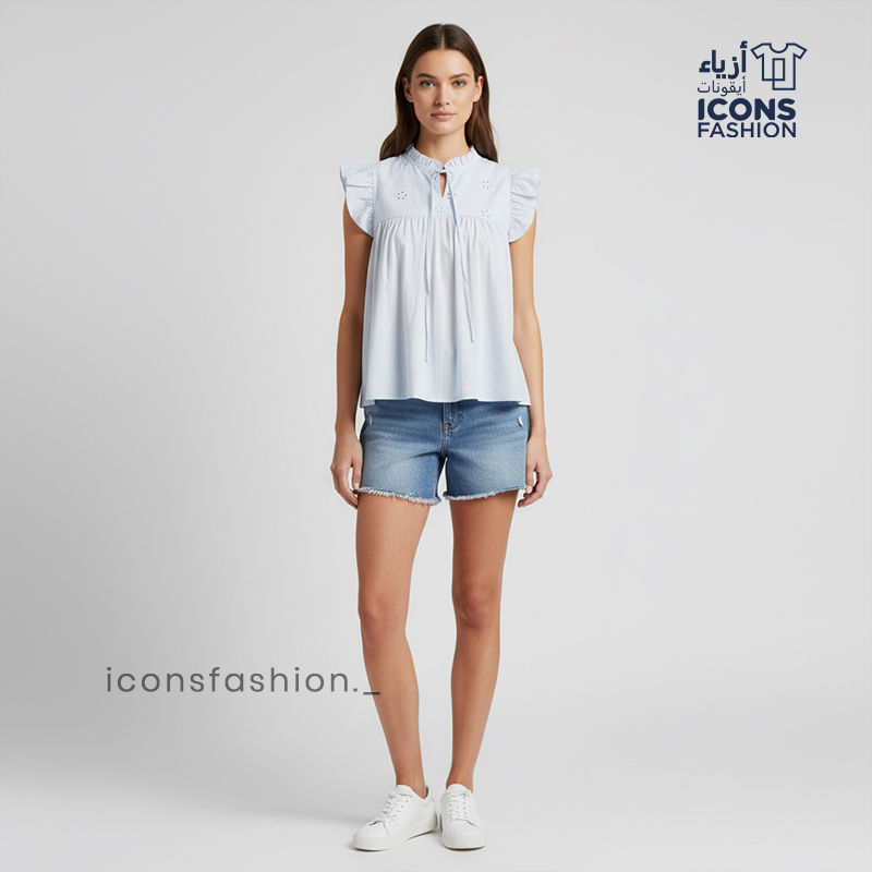 Pastel-blue-Aqaba-eyelet-embroidered-sleeveless-top-with-ruffle-sleeves-and-tie-up-neck