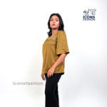 Mustard-yellow-satin-top-with-asymmetrical-mesh-and-embellished-detailing-near-the-neckline