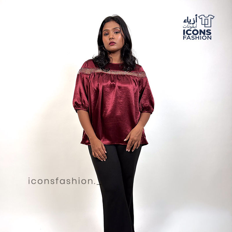 Wine-red-top-with-lace-detailing-across-the upper-chest-and-shoulders