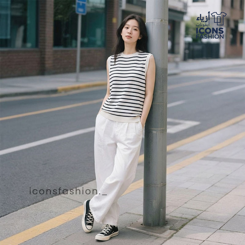 Women-wearing-black-and-white-striped-sleeveless-shirt-with-round-neck