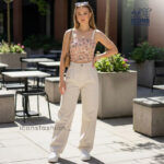 Woman-wearing-peach-floral-square-neck-crop-top-with-spaghetti-straps