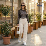 Woman-wearing-black-sheer-mesh-long-sleeve-embellished-top