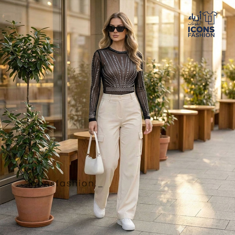 Woman-wearing-black-sheer-mesh-long-sleeve-embellished-top