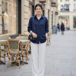 Woman-navy-blue-oversized-button-down-shirt-with-collared-neckline-full-sleeves