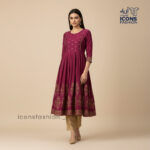 Woman-maroon-flared-anarkali-kurta-with-round-neck-three-quarter-sleeves-gold-printed-yoke-and-hem