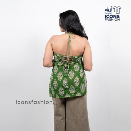 Woman-green-paisley-printed-sleeveless-halter-neck-kurta-with-open-back-and-tie-up-detail