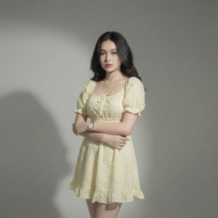Women-yellow-eyelet-mini-dress-with-square-neck-puff-sleeves-smocked-waist-and-fit-and-flare-silhouette