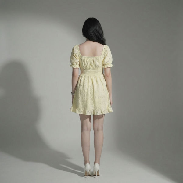 Women-yellow-eyelet-mini-dress-with-square-neck-puff-sleeves-smocked-waist-and-fit-and-flare-silhouette