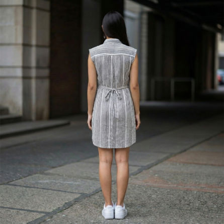 Black-and-white-vertical-striped-sleeveless-shirt-dress-with-collar-and-button-down-front